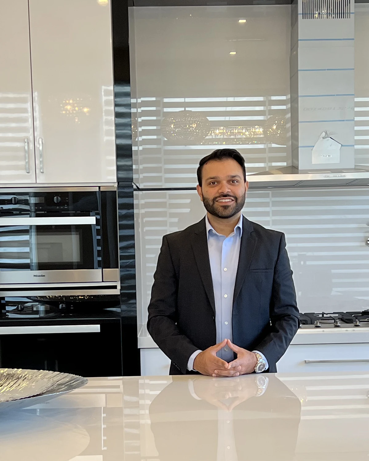 Usman Gillani, P.Eng., Real Estate Broker, in a modern GTA home